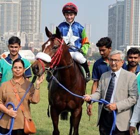 Trainer M K Jadhav leading in Miss American Pie (David Allan up), winner of Mulraj Goculdas Trophy at Mumbai on Sunday.